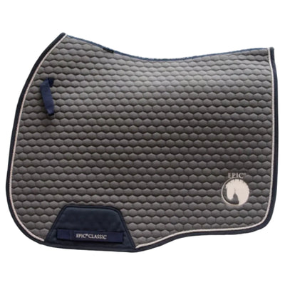 A dark gray quilted equestrian saddle pad with navy blue trim, a navy blue handle, and a navy blue brand patch at the bottom. The brand 'EPIC' is visible on the lower right with an equestrian logo, and 'EPIC CLASSIC' is embroidered on the patch.